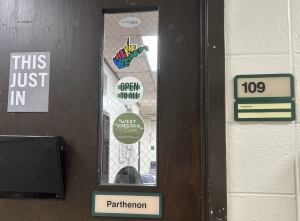 The Parthenon's newsroom door displays inclusive stickers. 